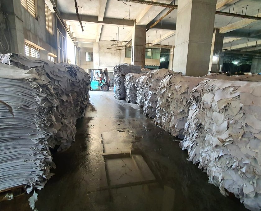 Wet blue hides stacked on pallets in a Bangladesh tannery warehouse
